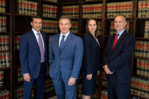 KinderCare abuse lawyers standing in their office